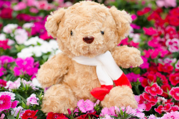 Teddy bear in flower garden