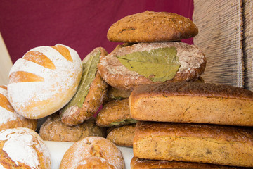 Freshly baked traditional loaves of rye bread on stall