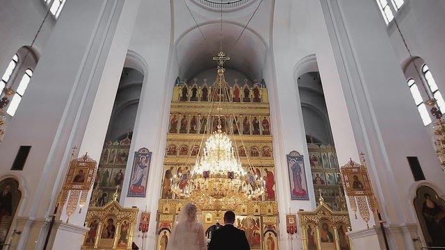 Bride and groom at the church during a wedding ceremony
