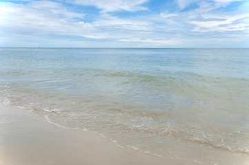 Fototapeta na wymiar Beautiful sea summer sand beach with blue ocean and cloudscape