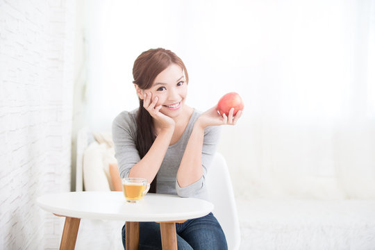 woman hold red apple