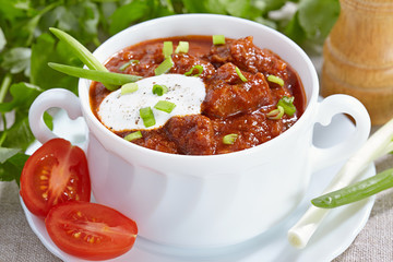 Hungarian cuisine. Goulash served in a white tureen