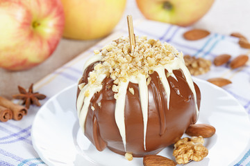 Apples in chocolate with nuts