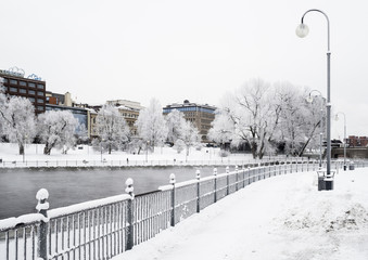 River in the middle of the city on a cold and cloudy winter day