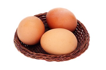 three eggs in basket
