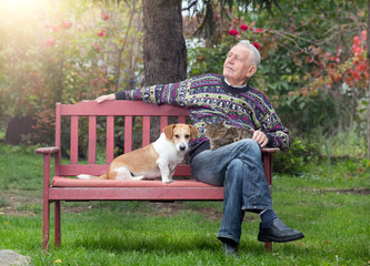 Senior man with dogs and cat