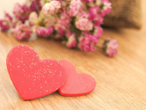 Valentines day background with red hearts on wood floor. Love and Valentine concept.