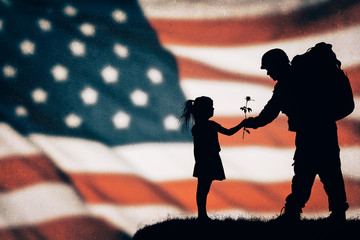 American soldier silhouette on the american flag