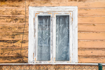 Window of an ancient wooden house, Poland