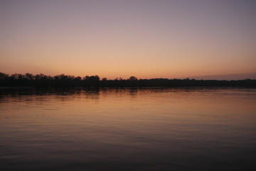 Fototapeta na wymiar Sunset over the river.