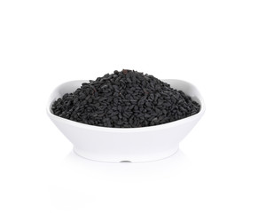 black sesame seeds in  bowl on white background