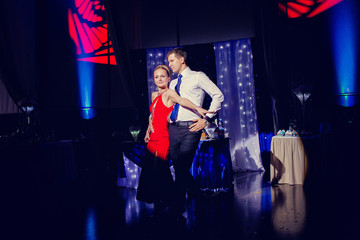 Bride and groom dancing at wedding reception.