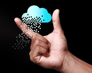 Cloud computing technology with hand on dark background.