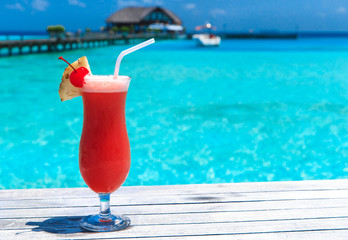 cocktail with blur beach on background