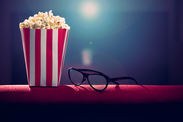 pop corn and 3d glass on armchair cinema © enjoyphoto