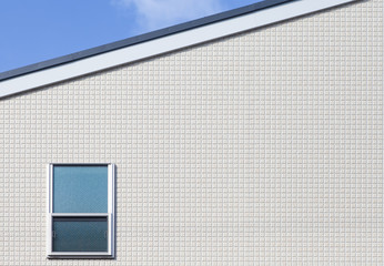 Detail of house exterior wall and window..
