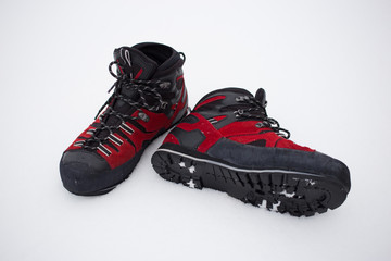 Climbing shoes red for difficult winter hikes.