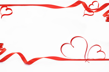 Ribbons shaped as hearts on white background.  Valentines day concept.