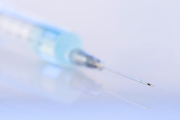 Sharp and hollow needle of the syringe. 