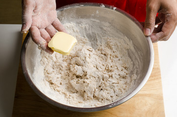 Mixing butter in the bowl by hand,bread cooking