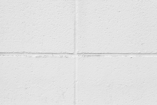 White concrete block wall texture and background seamless