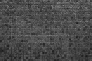 Grey and black mosaic wall texture and background.. - obrazy, fototapety, plakaty