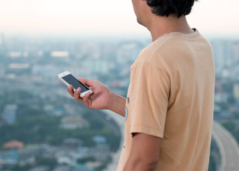 Close up of a man using mobile smart phone