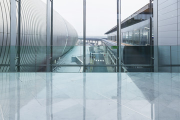 Connecting corridor in green glass hall.