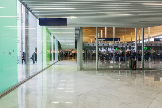 Connecting corridor in green glass hall.