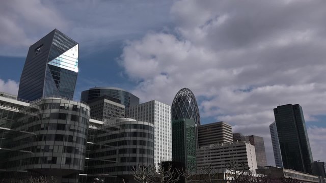 Office buildings time lapse clouds in La Defense, Paris - 60fps. Time lapse of some Office buildings on a sunny cloudy day in La Defense, Paris. 1080p
