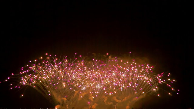 Colourful fireworks exploding high in the air. FullHD 1080p.