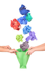 Clothing falls in shopping bag isolated on white