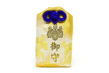 gold japanese luck omamori amulet on white background