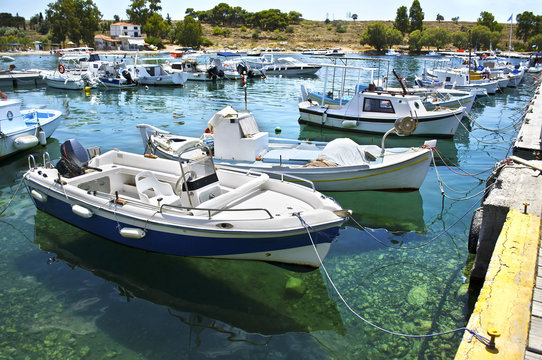 small harbor with boats in Aegean island Greece