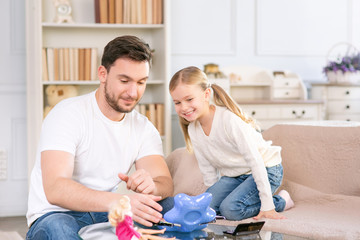Fototapeta premium Vivacious father and daughter laying together 