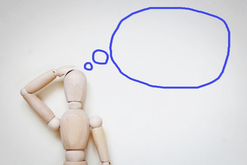 Man thinking about something. Abstract image with a wooden puppet