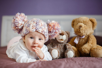 Portrait of a beautiful baby with plush toys