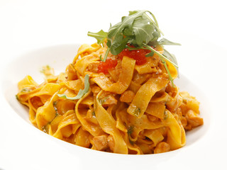 Delicious fresh pasta tossed with fresh tomatoes, basil and garlic. Shallow dof.
