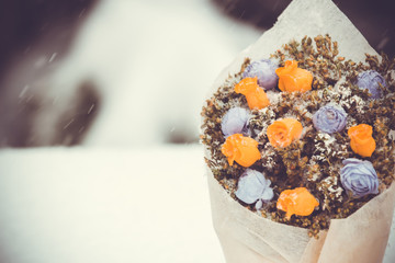 wedding bouquet in  snow, toned
