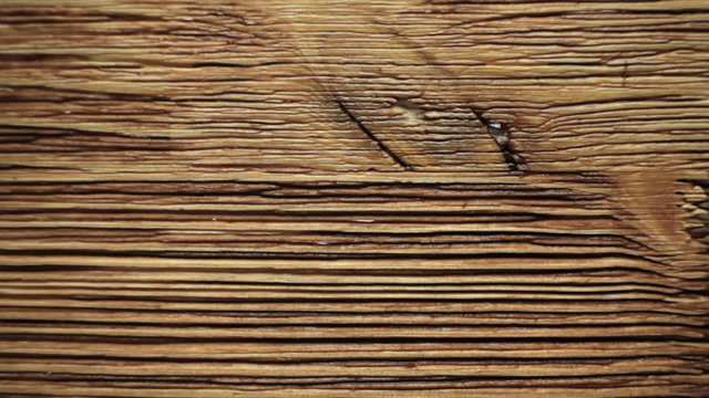 Paint brush painting  wooden table with wood stain