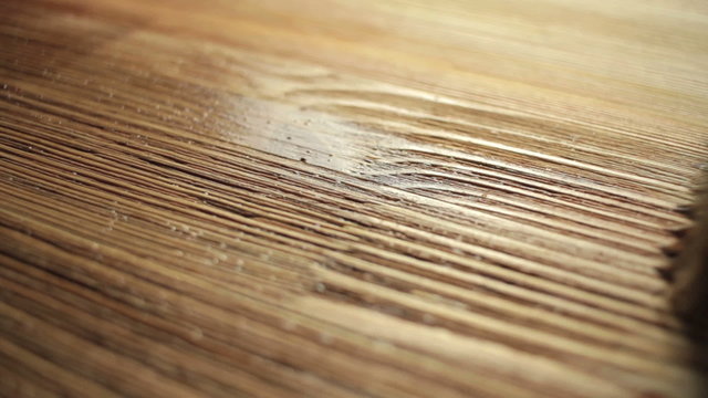 Wood painting with a brush with the brown color