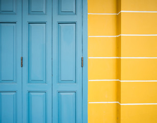 old blue door and yellow wall background
