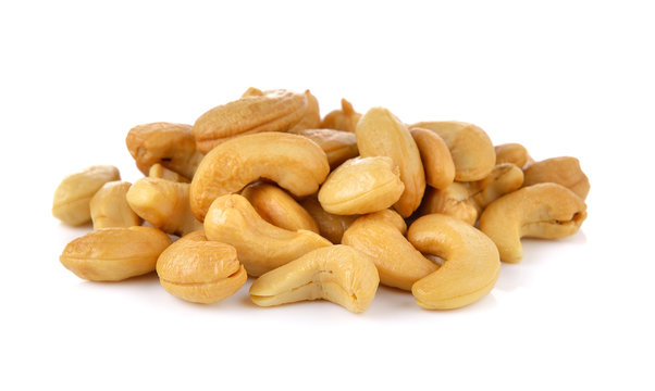 Cashews in the scoop on white background