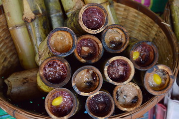 glutinous rice roasted in bamboo joints on market