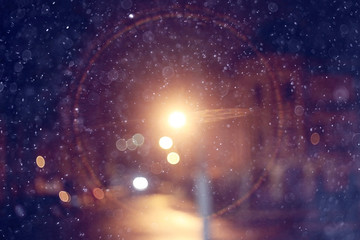 blurred background snow snowfall night lights glass