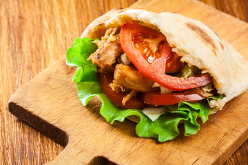 Doner kebab - fried chicken meat with vegetables