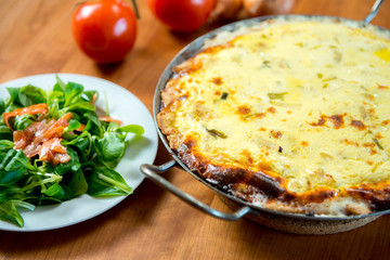 baked quiche with field salad