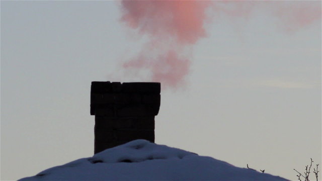  smoke from the chimney of house/pink smoke out of the chimney house in winter
