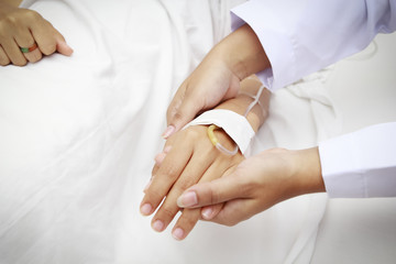 doctor holing patient's hands