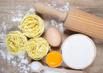 Raw homemade pasta and ingredients for pasta.